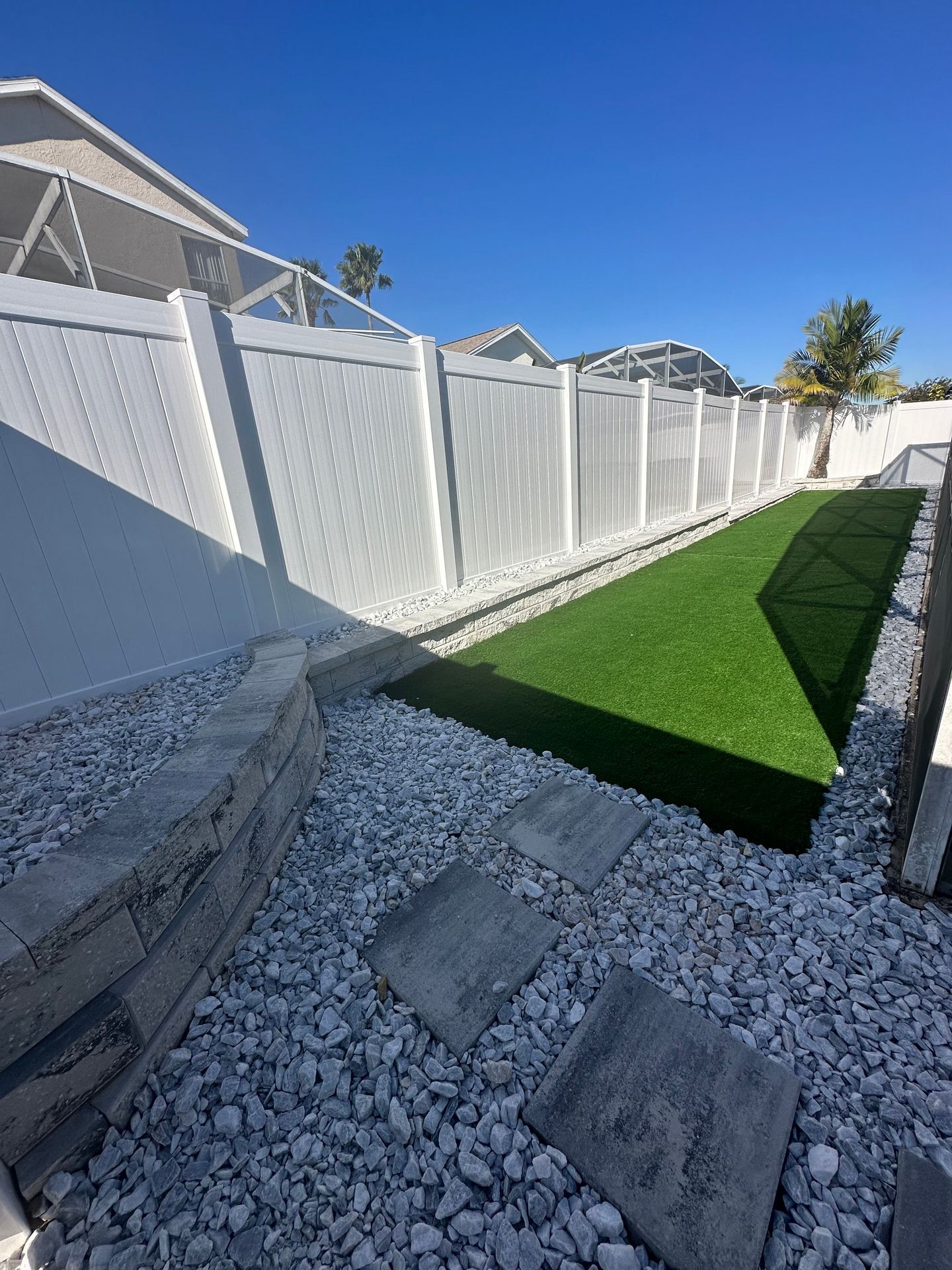 LUXE outdoor gravel, pavers, turf and fencing job